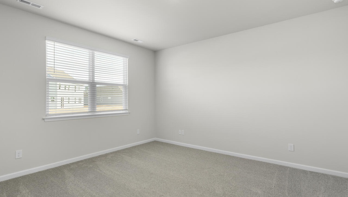 The Primary Suite offers a massive closet and a luxurious bathroom with a walk-in shower, linen closet, and dual vanity.