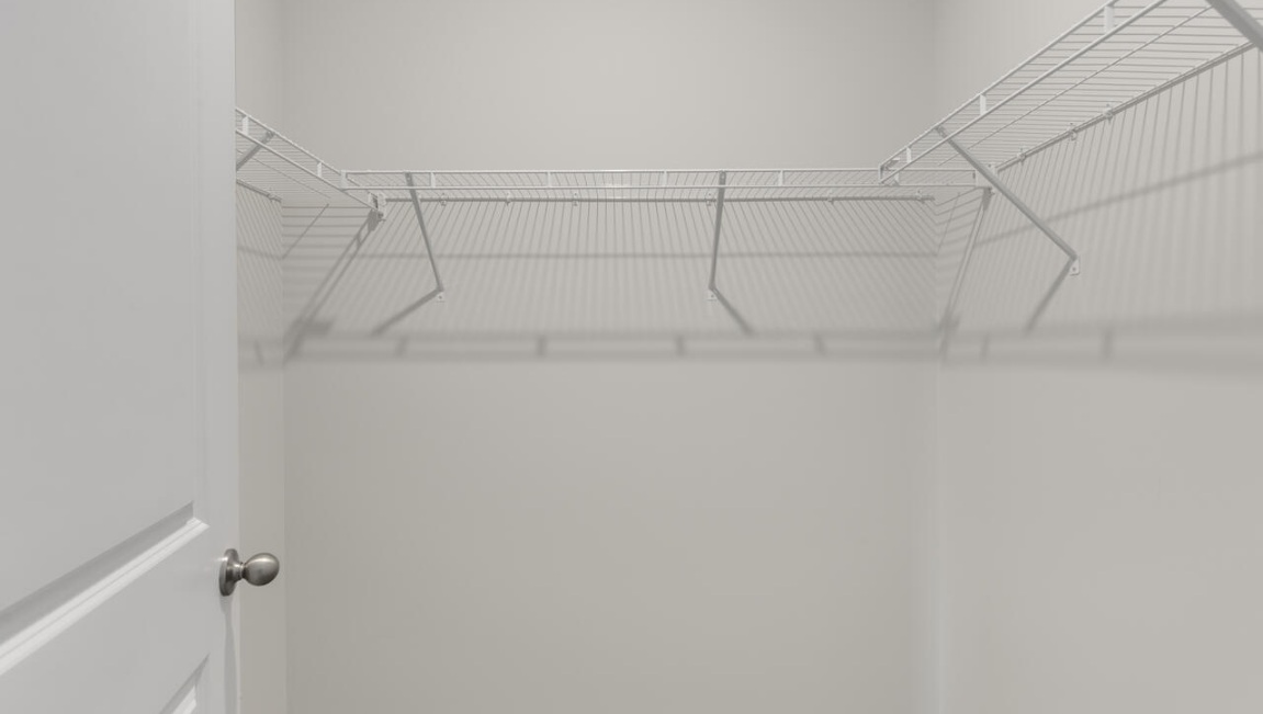 The Primary Suite offers a massive closet and a luxurious bathroom with a walk-in shower, linen closet, and dual vanity.