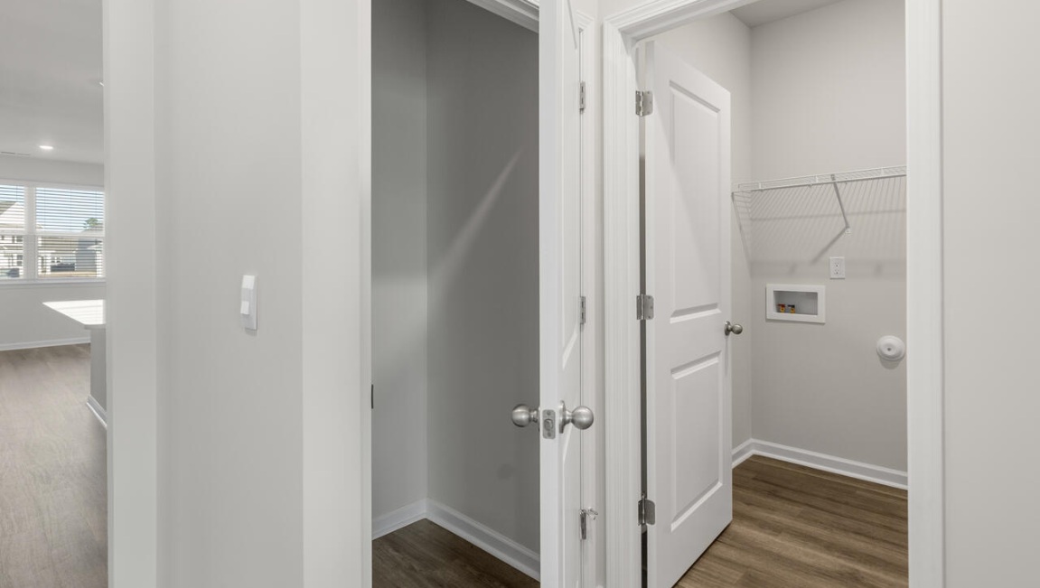The Primary Suite offers a massive closet and a luxurious bathroom with a walk-in shower, linen closet, and dual vanity.