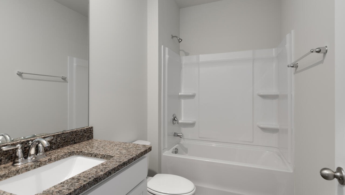 There are three additional bedrooms and full bath. In every bedroom you’ll have vinyl floors and a closet in each room.