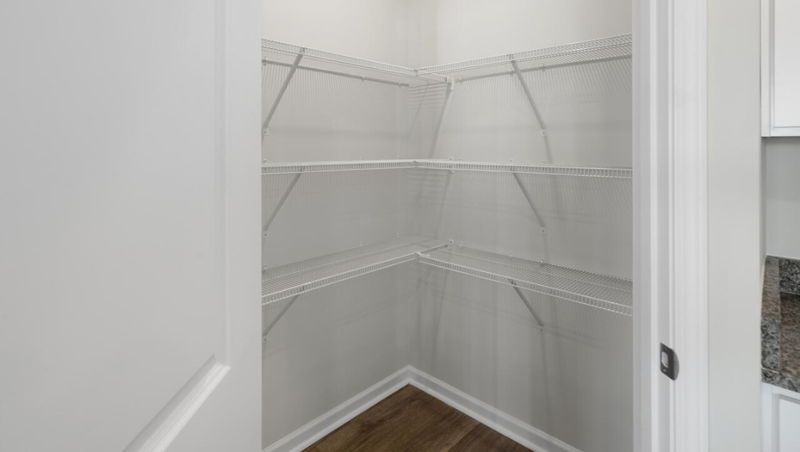 The kitchen features beautiful cabinets, granite countertops, and stainless steel appliances, which are sure to both turn heads and make meal prep easy.