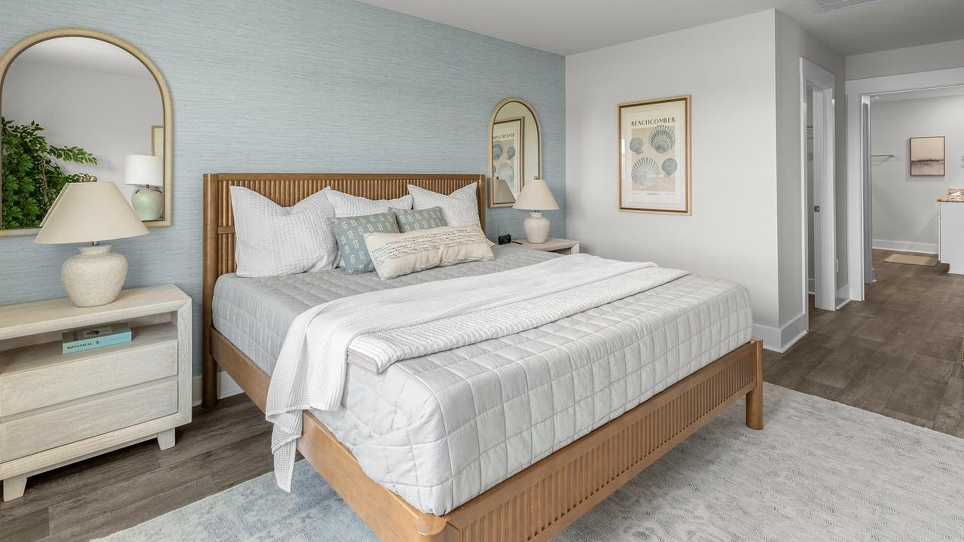 The Primary Suite offers a massive closet and a luxurious bathroom with a walk-in shower, linen closet, and dual vanity