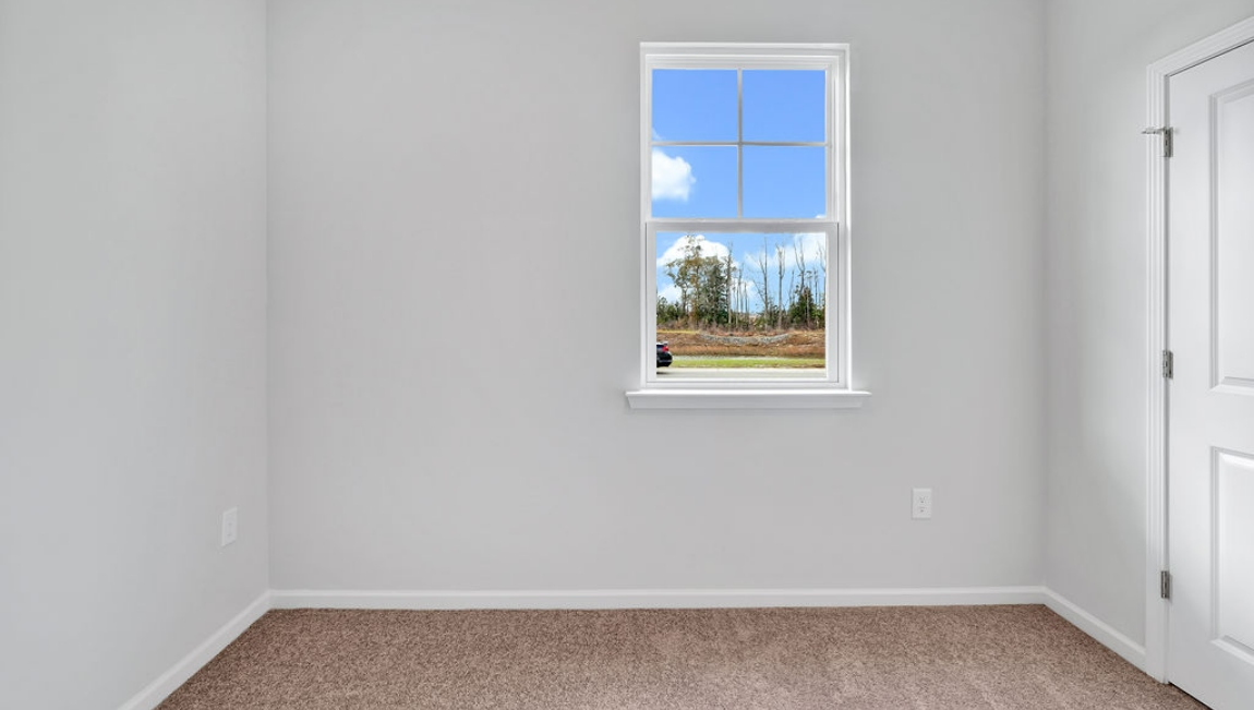 At the front are two guest bedrooms and a full bathroom, perfect for visitors or a home office.