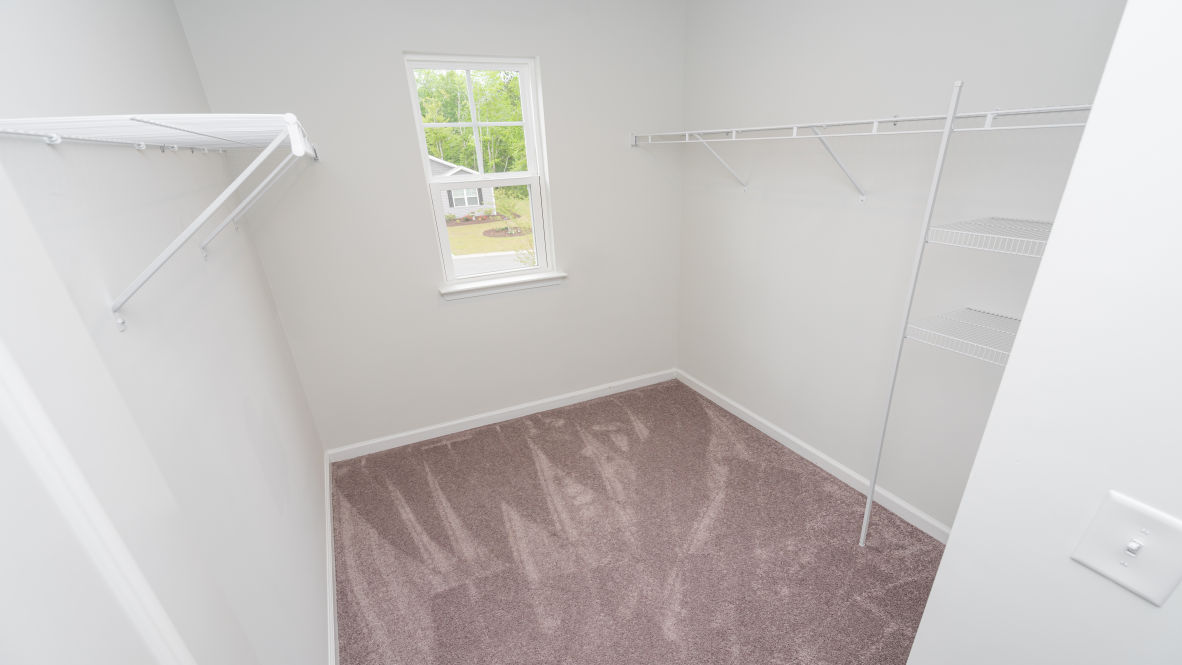 The primary bedroom is a perfect retreat with a walk-in closet and generous primary bathroom featuring a double vanity, large shower, and a separate linen closet