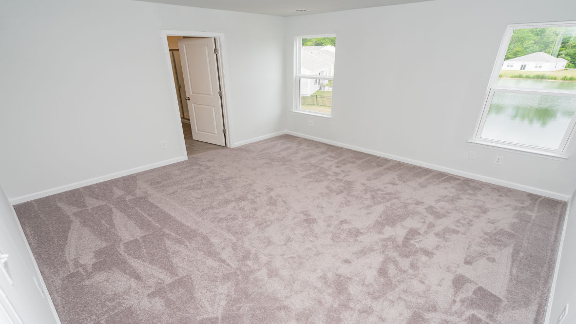 The primary bedroom is a perfect retreat with a walk-in closet and generous primary bathroom featuring a double vanity, large shower, and a separate linen closet. Plus, the laundry room is on the second floor with all the bedrooms!