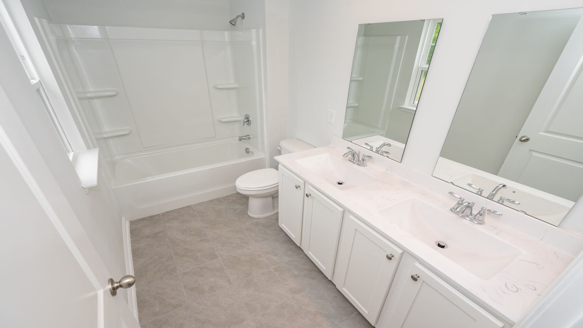 The primary bedroom is a perfect retreat with a walk-in closet and generous primary bathroom featuring a double vanity, large shower, and a separate linen closet. Plus, the laundry room is on the second floor with all the bedrooms!