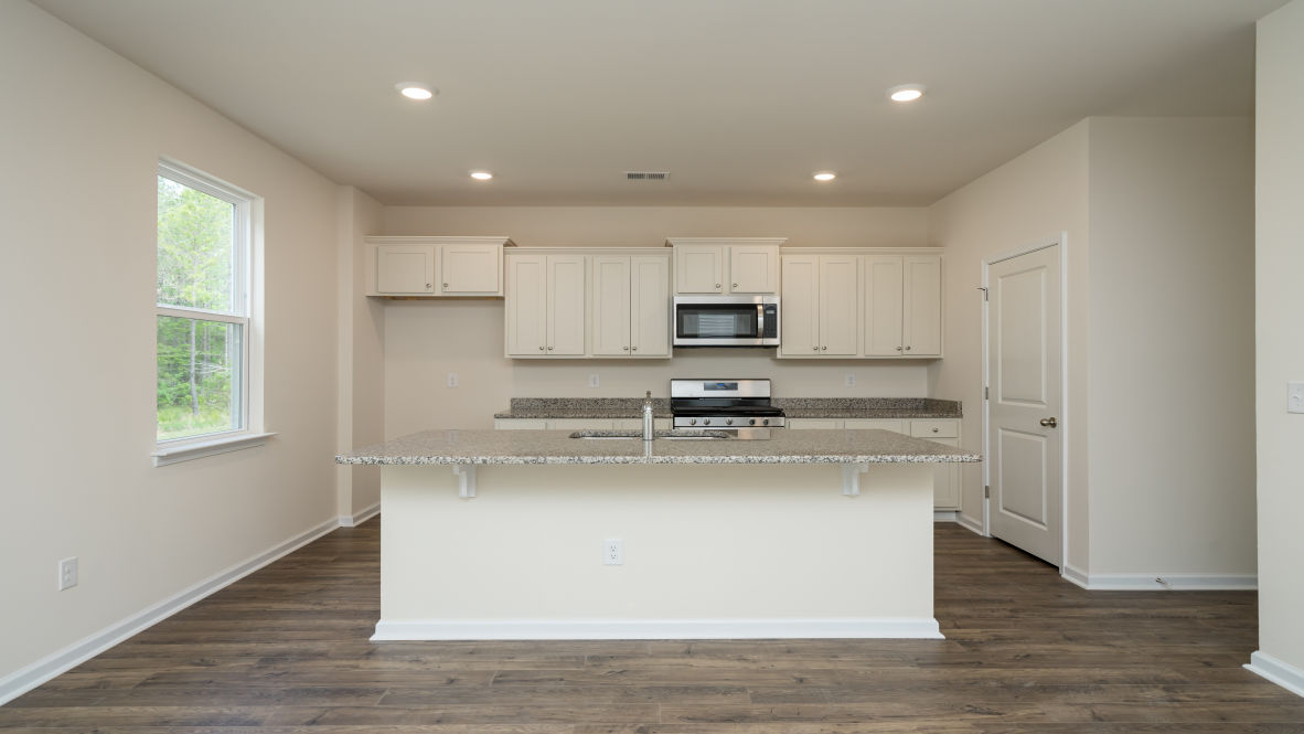 The living area is an open concept, where your kitchen, living, and dining areas blend seamlessly into a space perfect for everyday living and entertaining.