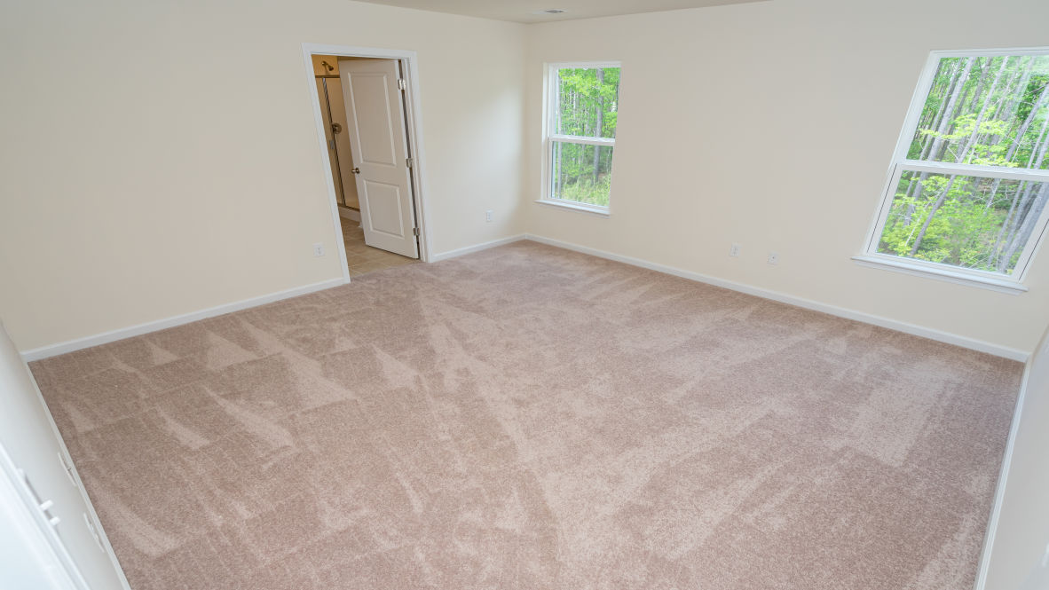 The primary bedroom is a perfect retreat with a walk-in closet and generous primary bathroom featuring a double vanity, large shower, and a separate linen closet. Plus, the laundry room is on the second floor with all the bedrooms!