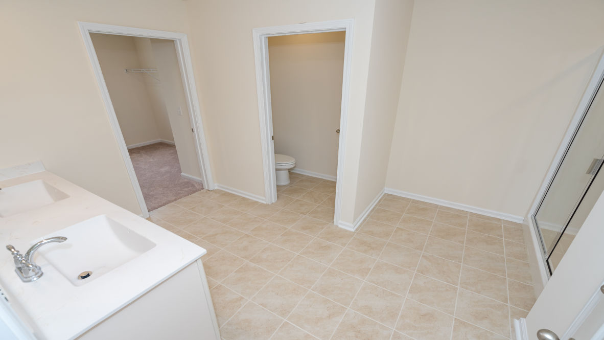 The primary bedroom is a perfect retreat with a walk-in closet and generous primary bathroom featuring a double vanity, large shower, and a separate linen closet. Plus, the laundry room is on the second floor with all the bedrooms!
