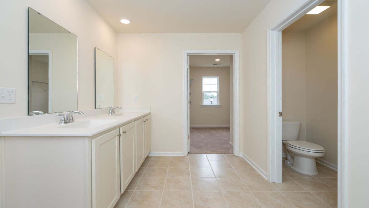 The primary bedroom is a perfect retreat with a walk-in closet and generous primary bathroom featuring a double vanity, large shower, and a separate linen closet. Plus, the laundry room is on the second floor with all the bedrooms!