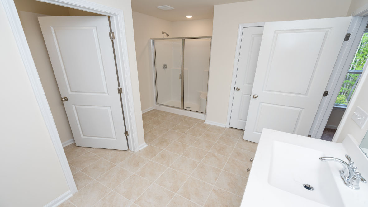 The primary bedroom is a perfect retreat with a walk-in closet and generous primary bathroom featuring a double vanity, large shower, and a separate linen closet. Plus, the laundry room is on the second floor with all the bedrooms!