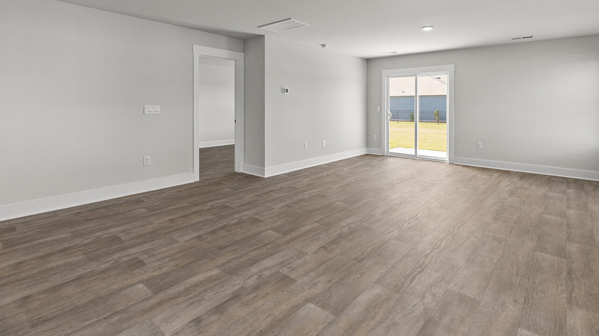 Entering the great room, we find the dining area, family room and a wonderful cook's kitchen are all together for open living.