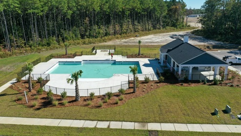 New Homes in Bolivia, NC. The Devon is floorplan is designed for efficient living and comfort. Past the Foyer and 2 front bedrooms.  And that's not all—we also provide a host of amenities, including a pool, an amenity building, an exercise fitness room, and a fire pit.