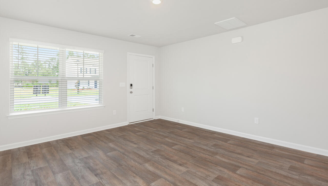 Entering the home we find a large family room and dining area that's perfect for entertaining.