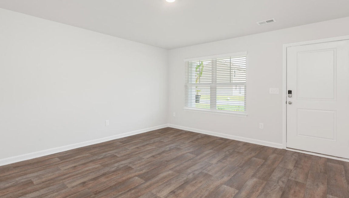 Entering the home we find a large family room and dining area that's perfect for entertaining.