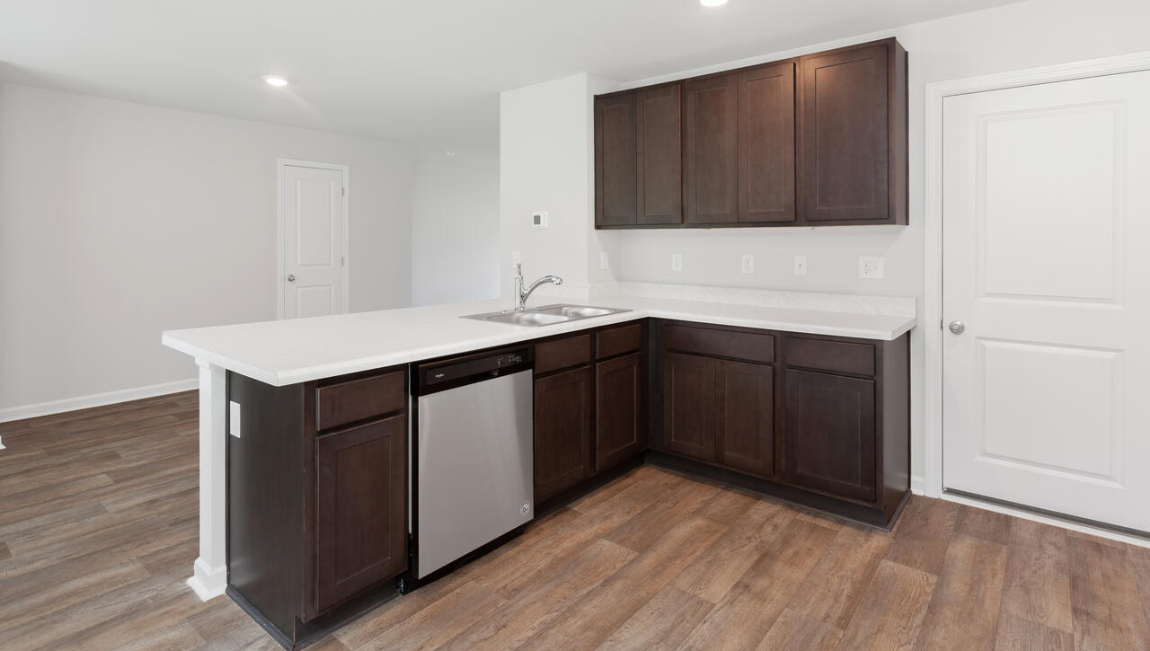 The heart of the home is the kitchen granite counters, a large peninsula island with room for 4 counter height barstools. The stainless-steel appliances, microwave, dishwasher and single bowl sink.