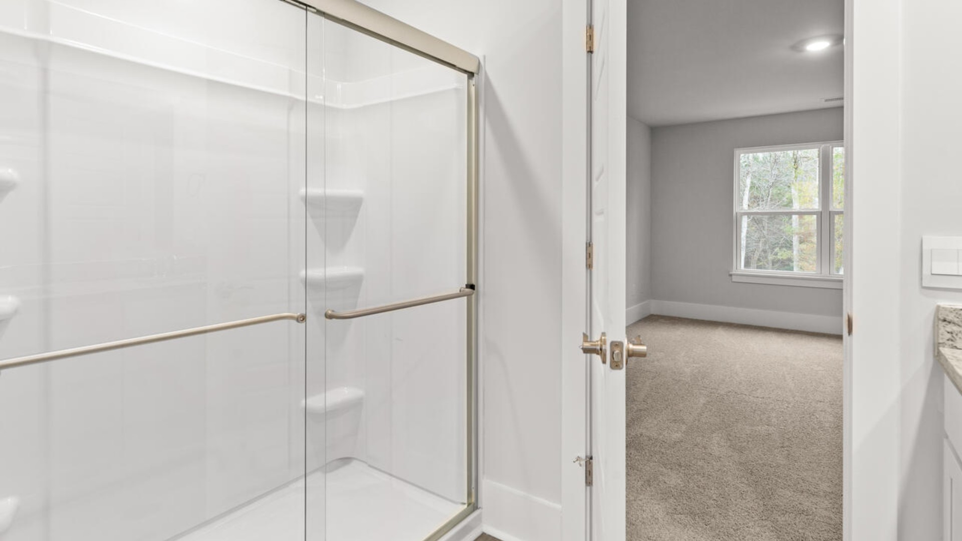 The primary bedroom has its own attached bathroom that features a walk-in closet and all the space you need to get ready in the morning.