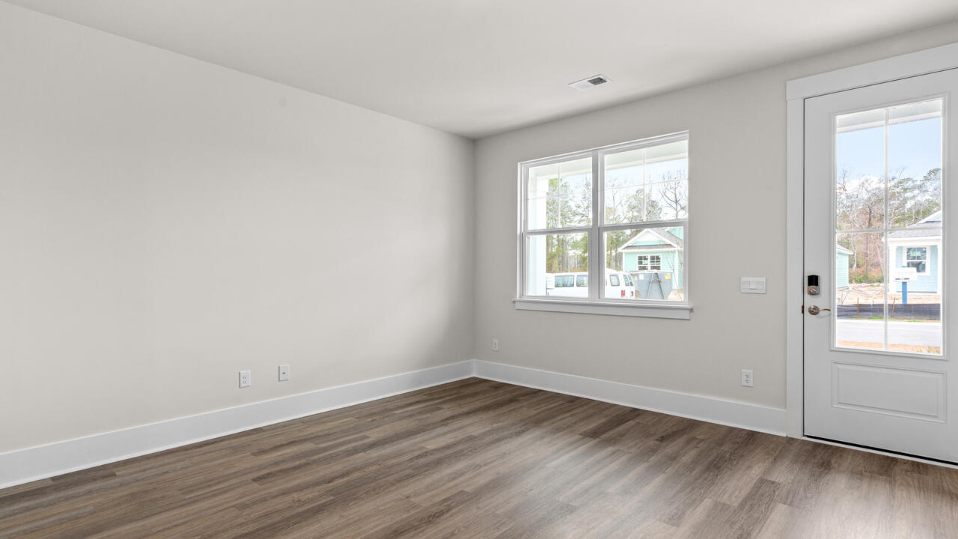 Entering the home, we find a large family room and dining area that's perfect for entertaining.