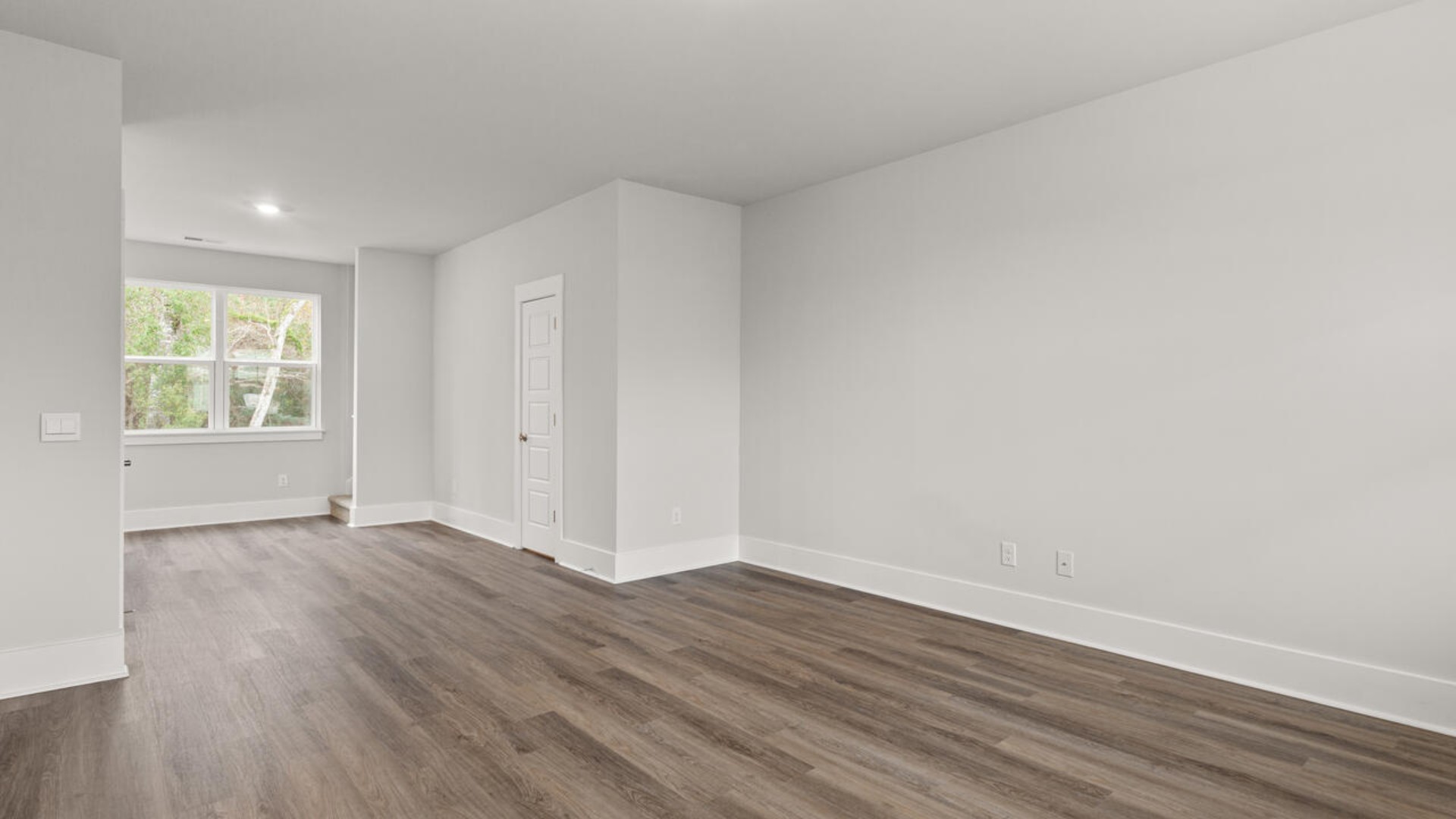 Entering the home, we find a large family room and dining area that's perfect for entertaining.