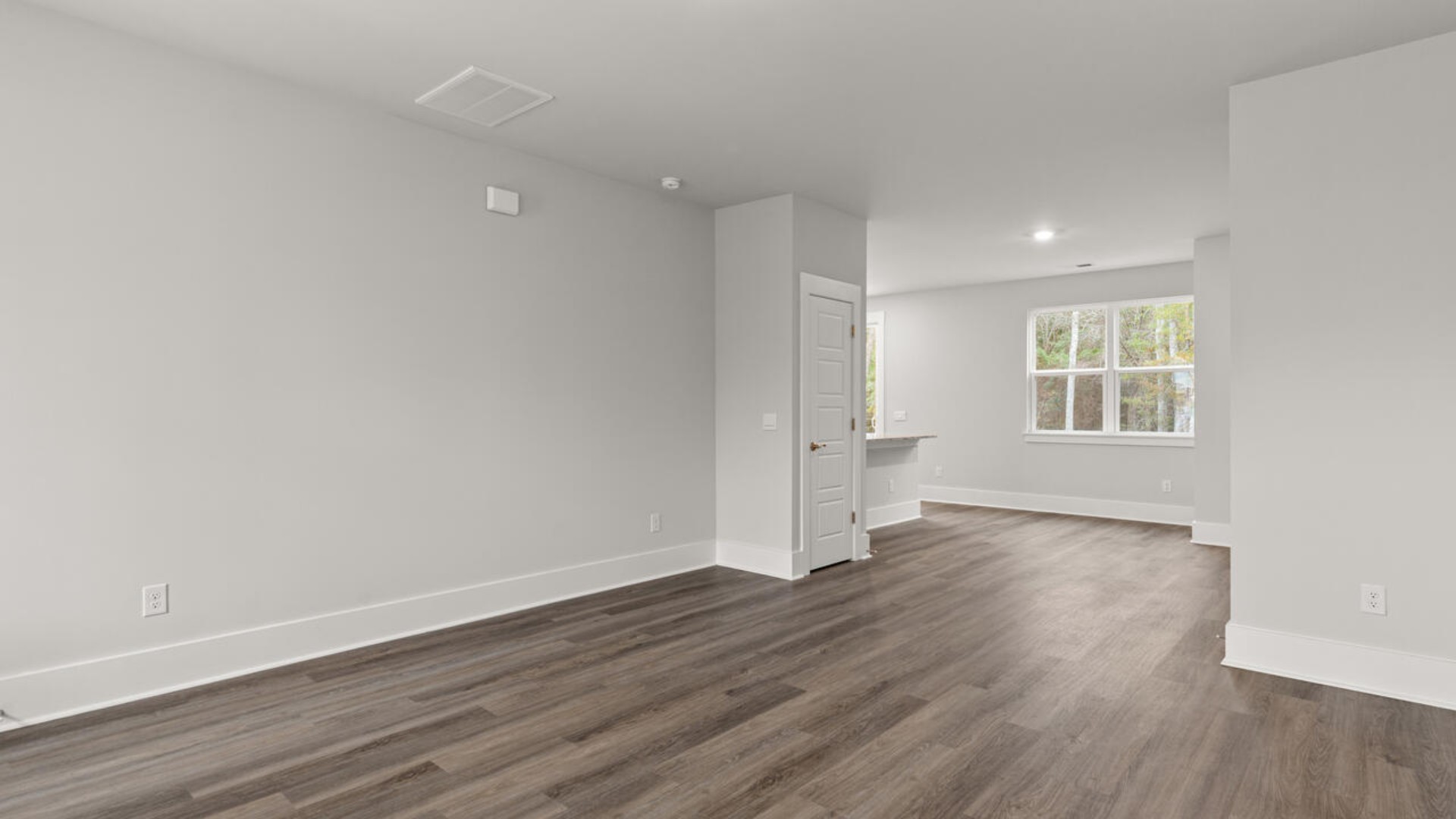 Entering the home, we find a large family room and dining area that's perfect for entertaining.