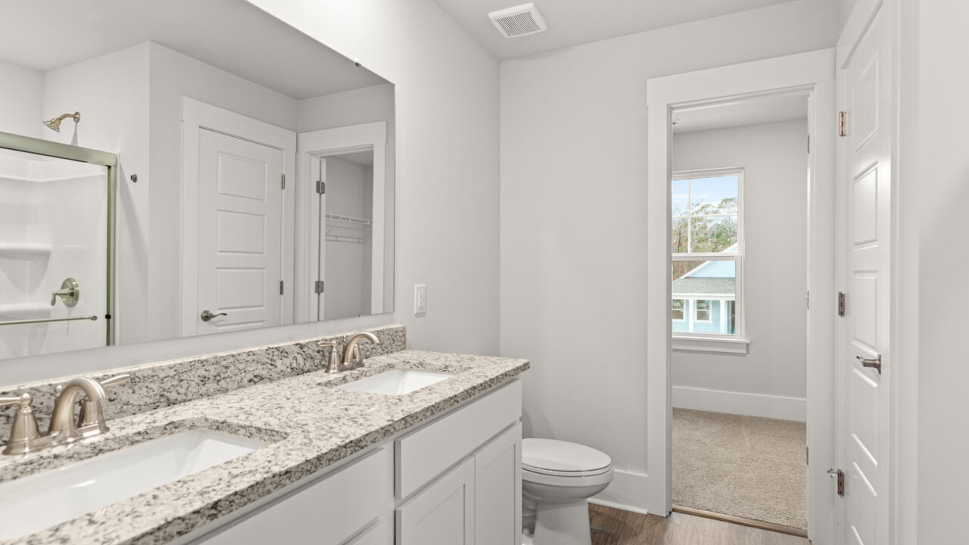 The primary bedroom has its own attached bathroom that features a walk-in closet and all the space you need to get ready in the morning.