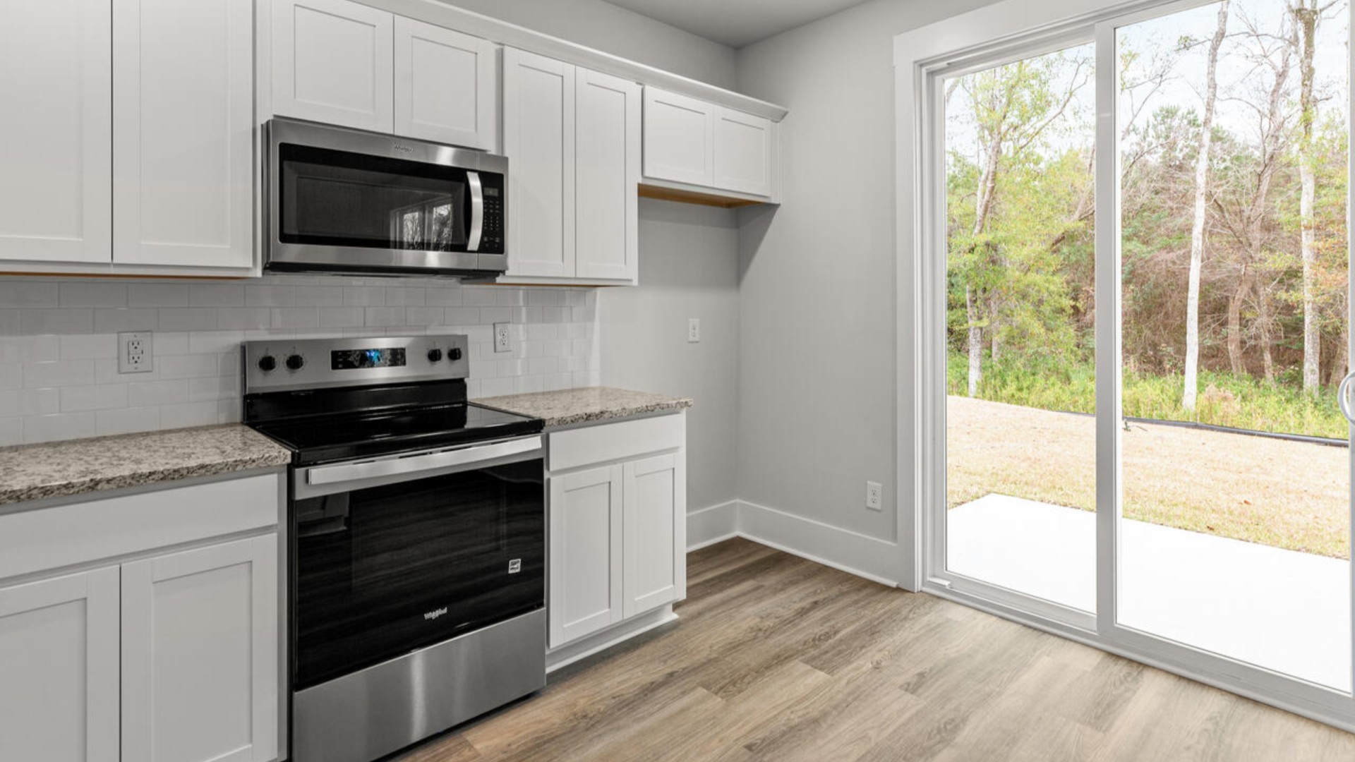 Entering the home we find a large family room and dining area that's perfect for entertaining. The heart of the home is the kitchen granite counters, a large peninsula island with room for 4 counter height barstools. T