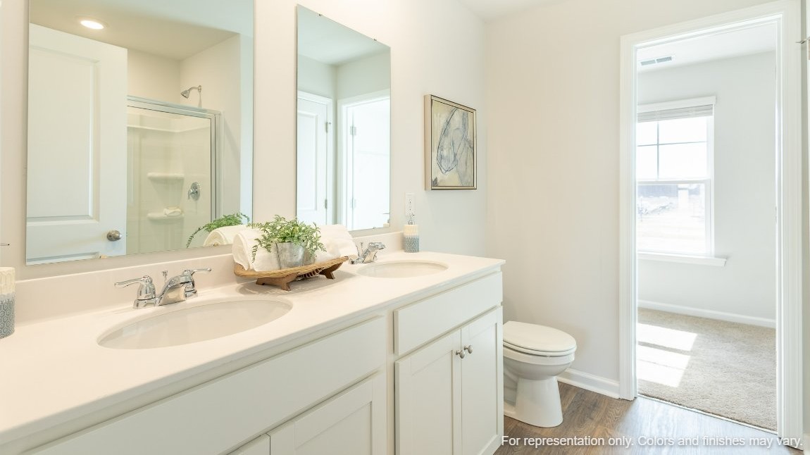 The primary bedroom has its own attached bathroom that features a walk-in closet and all the space you need to get ready in the morning. Sharing a sink isn’t a worry with the double vanity, and you also get additional privacy with a separate door for the toilet and shower.