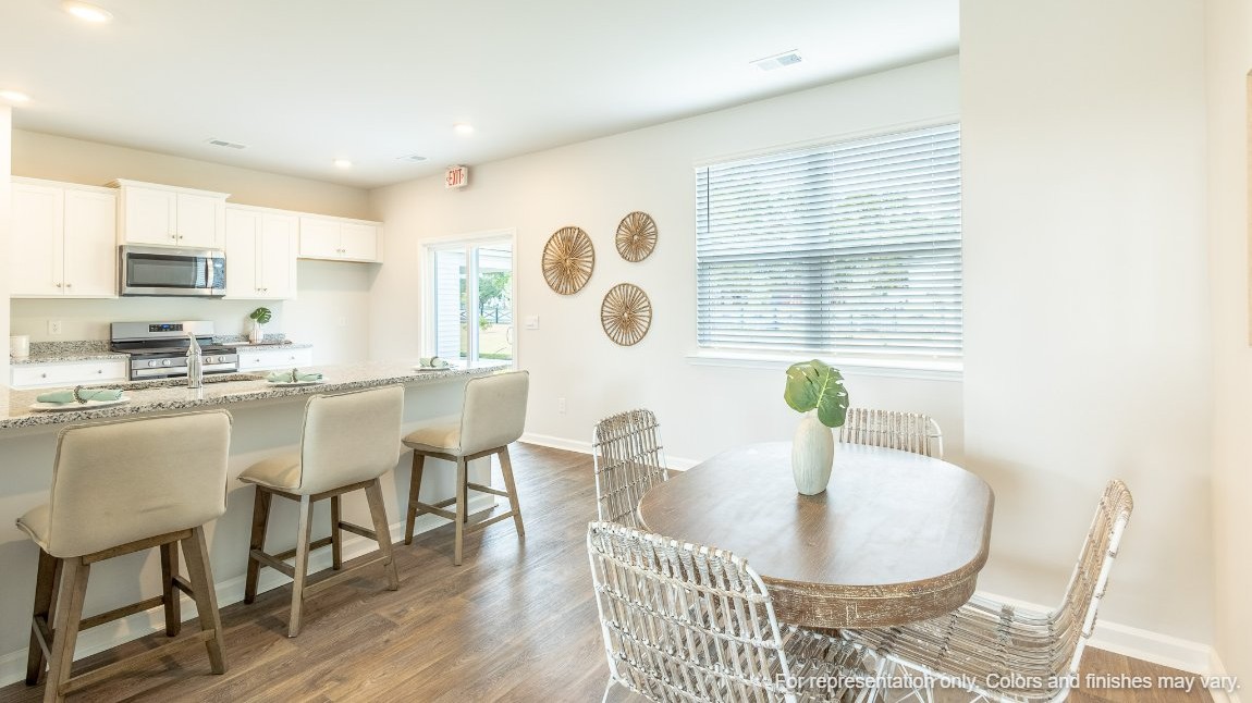 Entering the home we find a large family room and dining area that's perfect for entertaining. The heart of the home is the kitchen granite counters, a large peninsula island with room for 4 counter height barstools. The stainless-steel Whirlpool appliances include a 5-burner gas range, microwave, dishwasher, single-bowl sink and even a refrigerator!