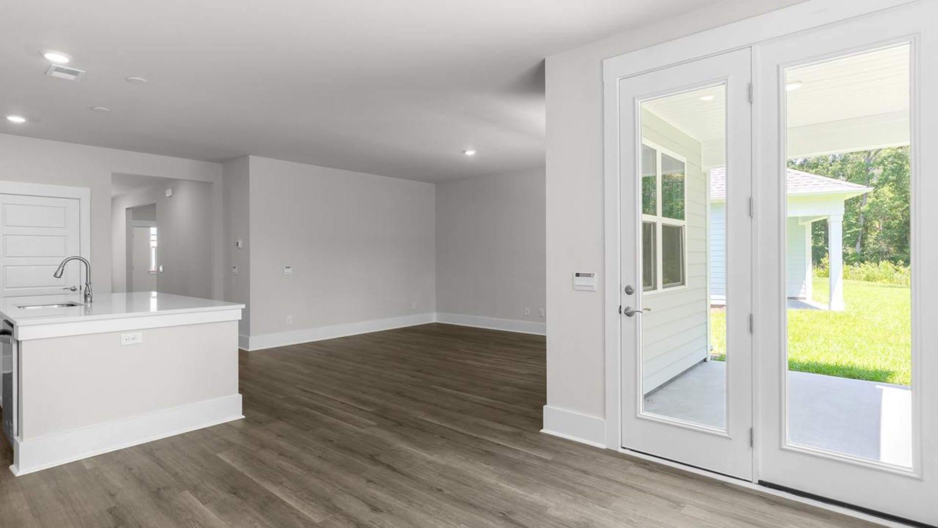 The open-concept kitchen, living, and dining area is perfect for everyday living and entertaining.