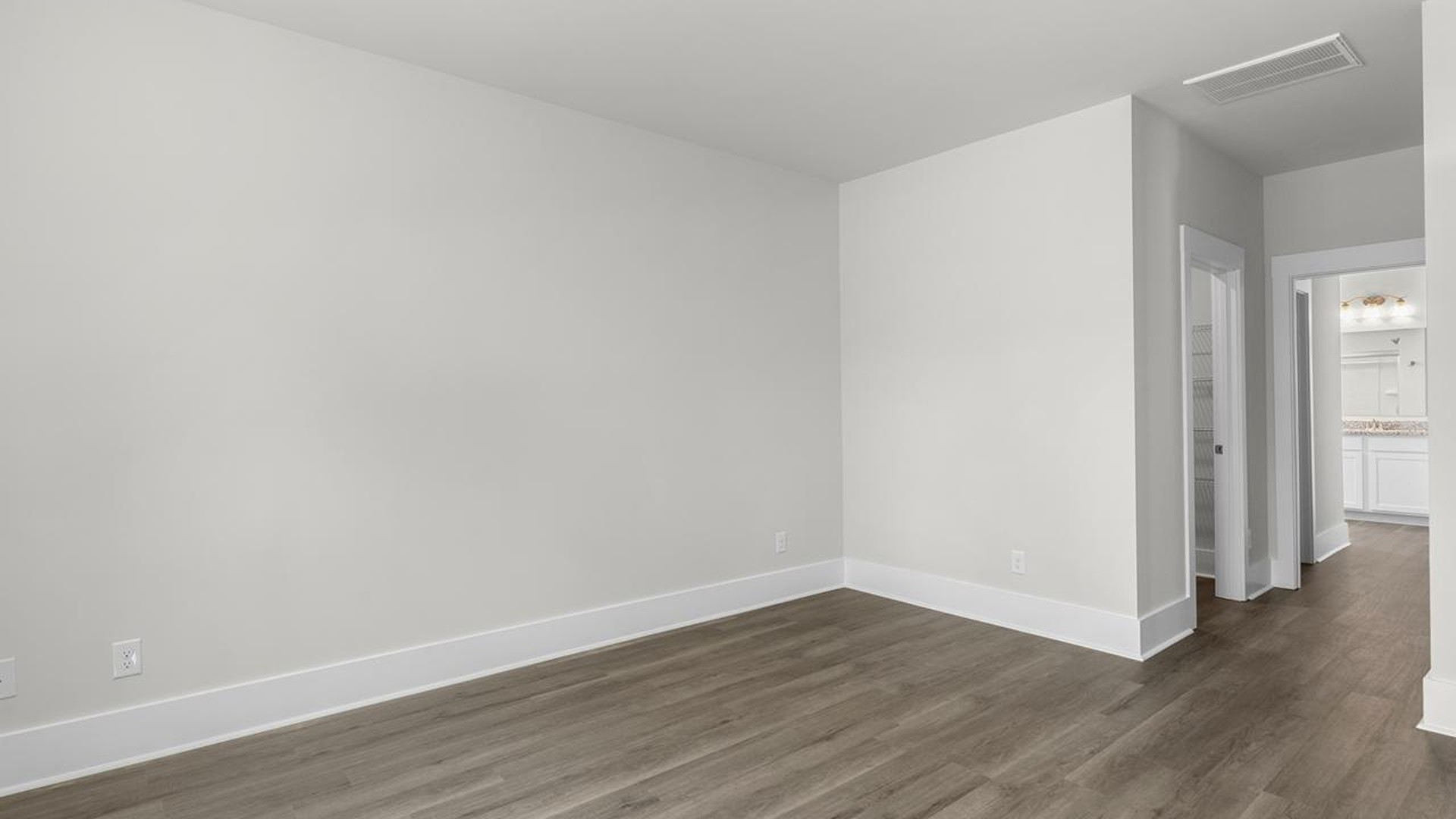 The downstairs primary suite includes a walk-in-closet and ensuite bath with a double vanity, walk-in-shower, and separate water closet. The guest ensuite upstairs provides tons of privacy and LVP flooring throughout the main level makes cleanups a breeze
