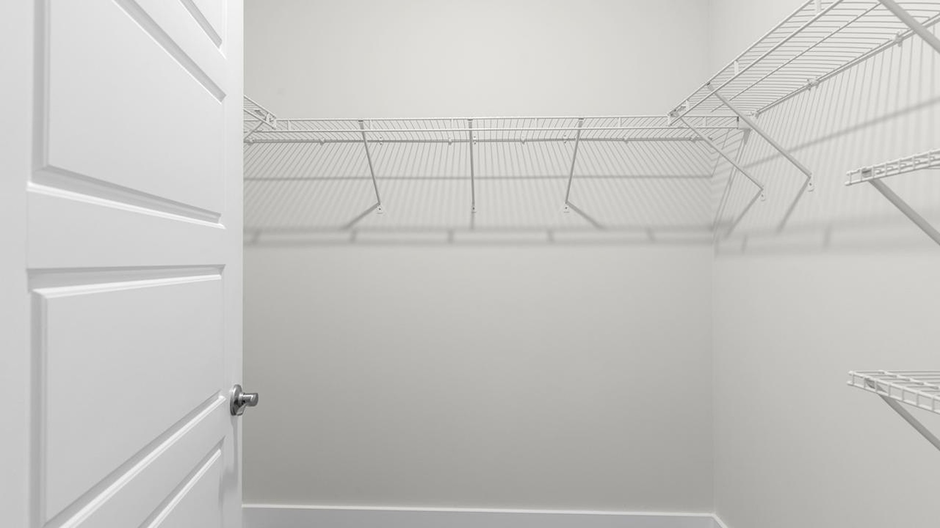 The downstairs primary suite includes a walk-in-closet and ensuite bath with a double vanity, walk-in-shower, and separate water closet. The guest ensuite upstairs provides tons of privacy and LVP flooring throughout the main level makes cleanups a breeze