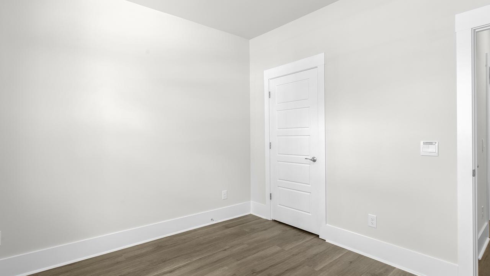As you make your way off the front porch, a foyer leads you into the heart of the home. Two bedrooms sit off the main foyer and share a full bathroom in the middle