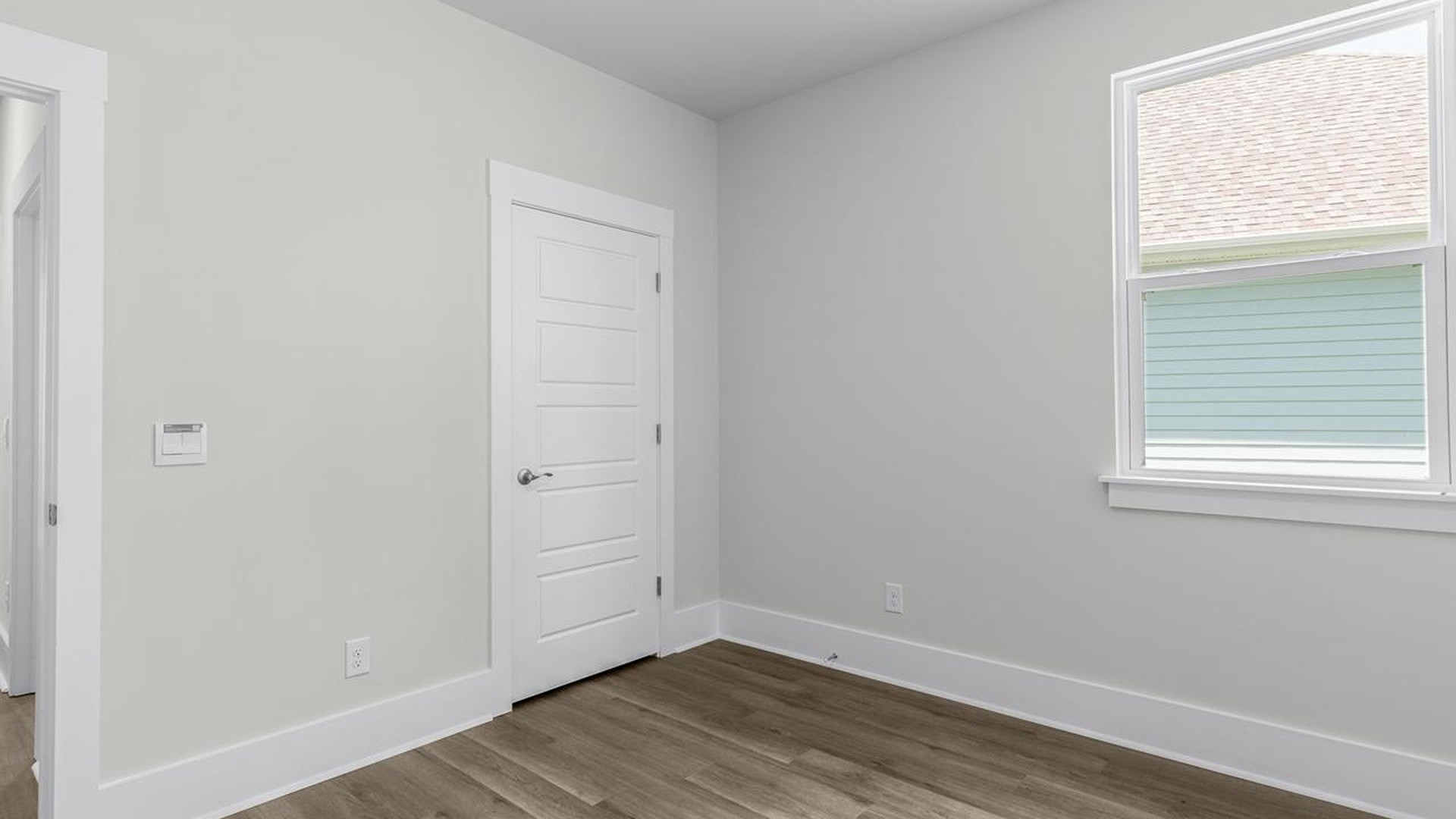 As you make your way off the front porch, a foyer leads you into the heart of the home. Two bedrooms sit off the main foyer and share a full bathroom in the middle