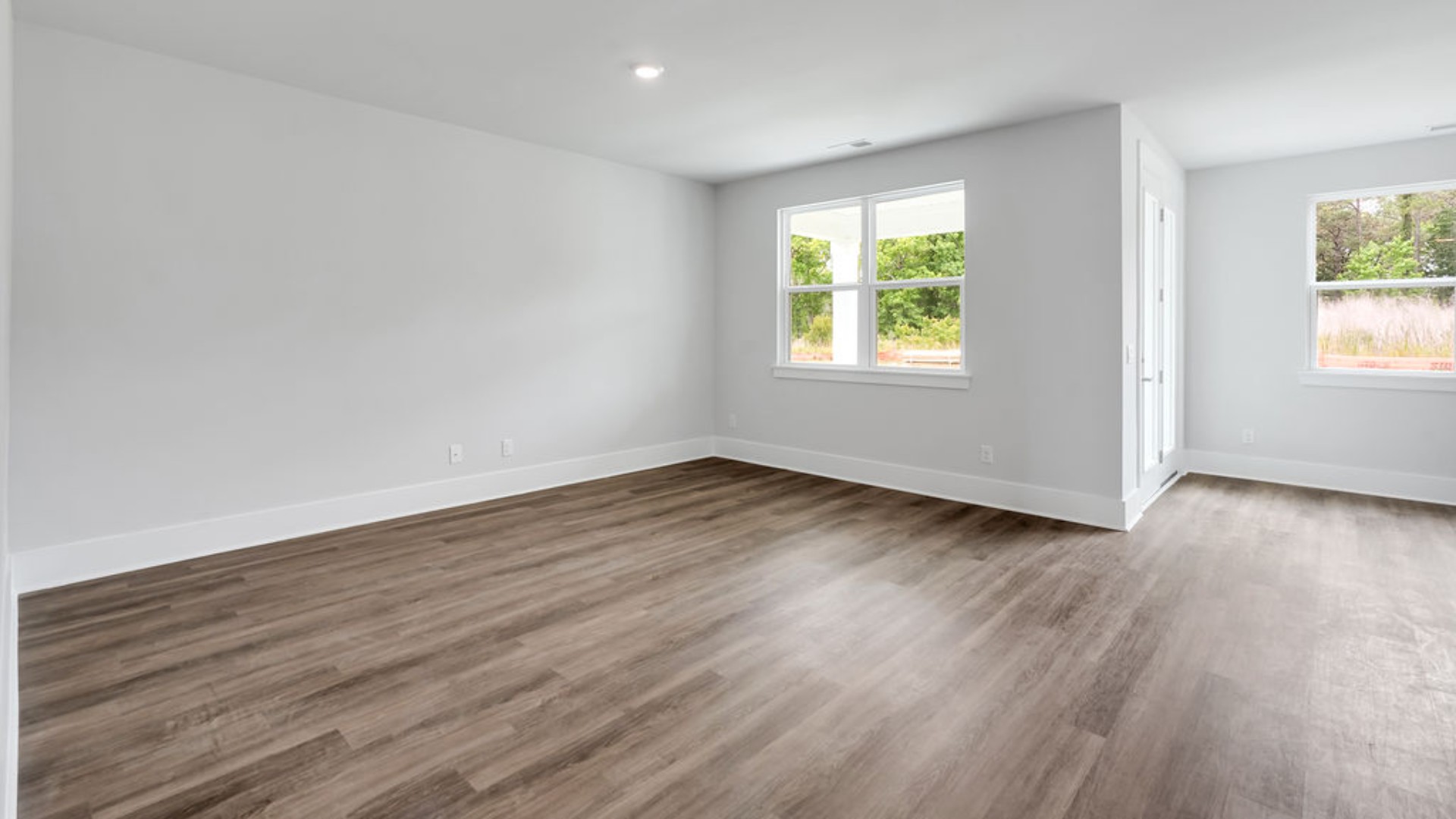 The main living area does not disappoint, by offering plenty of room to gather with family and friends. The kitchen includes a walk-in pantry, stainless-steel appliances, and a large island for bar seating.