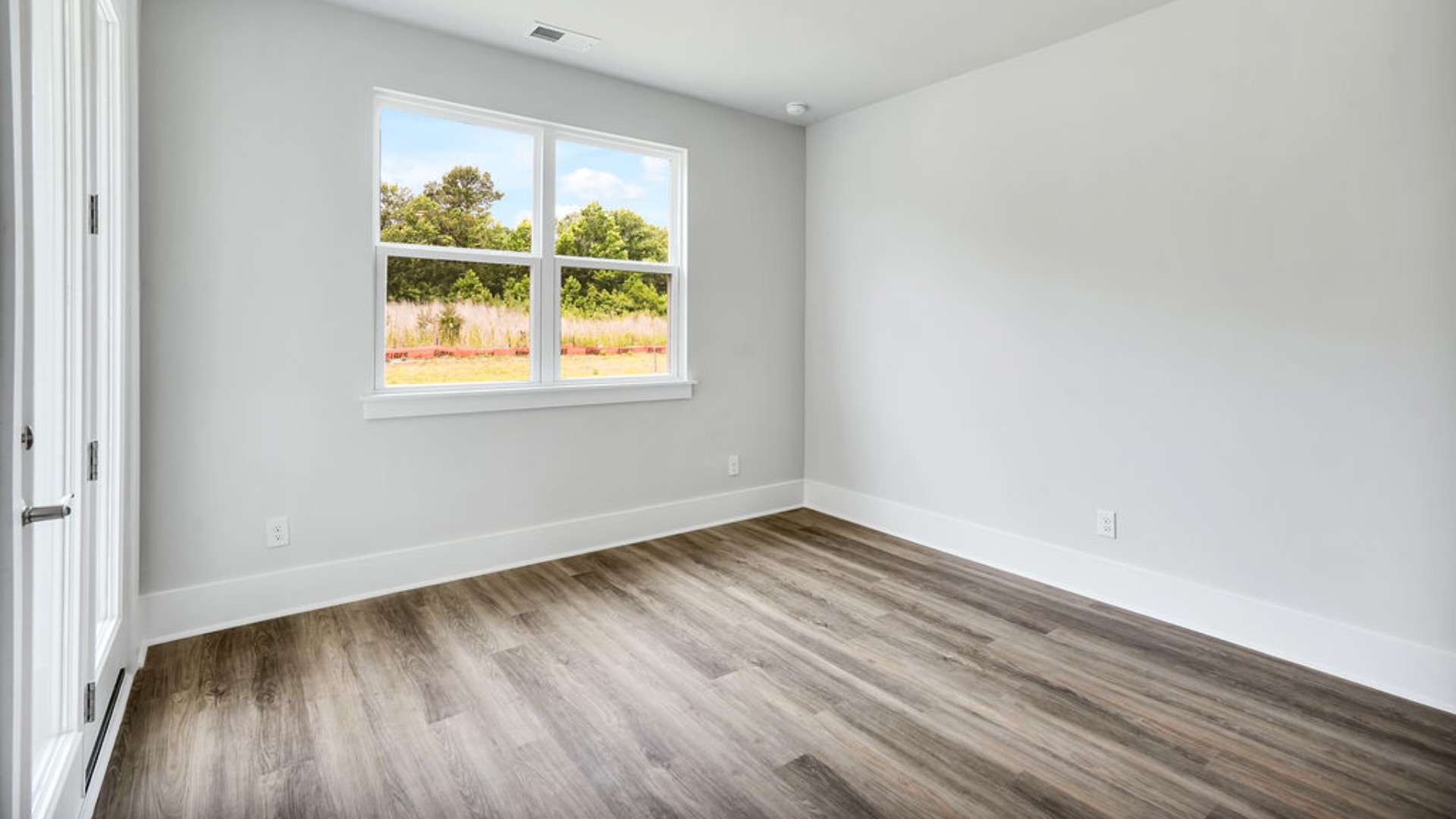 The primary suite is tucked away in the back corner of the home and allows homeowners the privacy to relax and unwind. The primary bedroom boasts a walk-in closet, dual vanity, and separate soaking tub and walk-in shower.