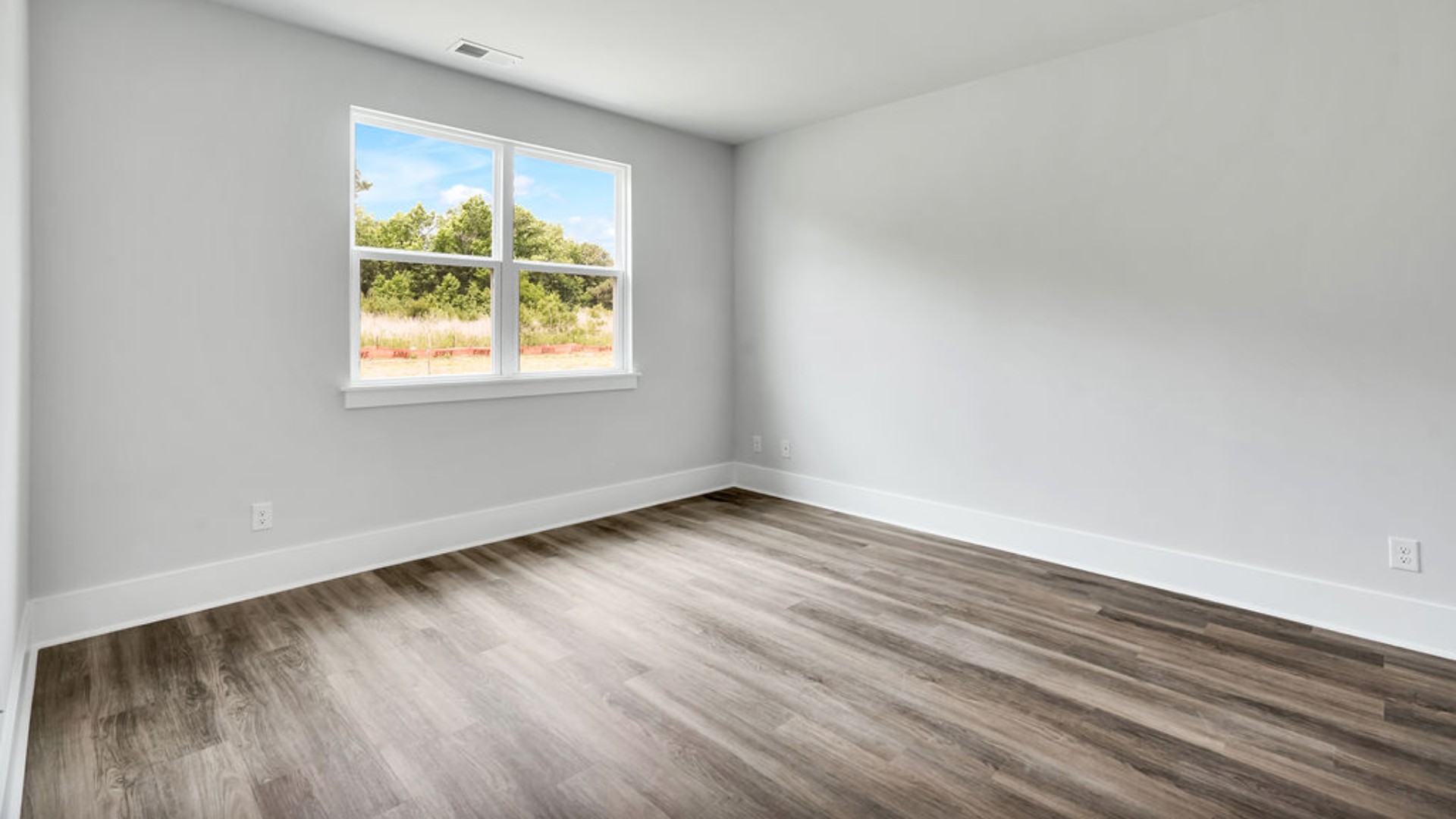 The primary suite is tucked away in the back corner of the home and allows homeowners the privacy to relax and unwind. The primary bedroom boasts a walk-in closet, dual vanity, and separate soaking tub and walk-in shower.