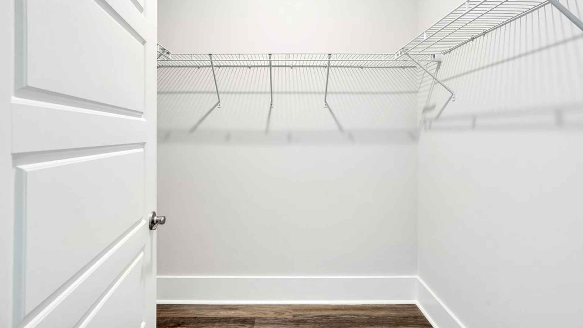The primary suite is tucked away in the back corner of the home and allows homeowners the privacy to relax and unwind. The primary bedroom boasts a walk-in closet, dual vanity, and separate soaking tub and walk-in shower.