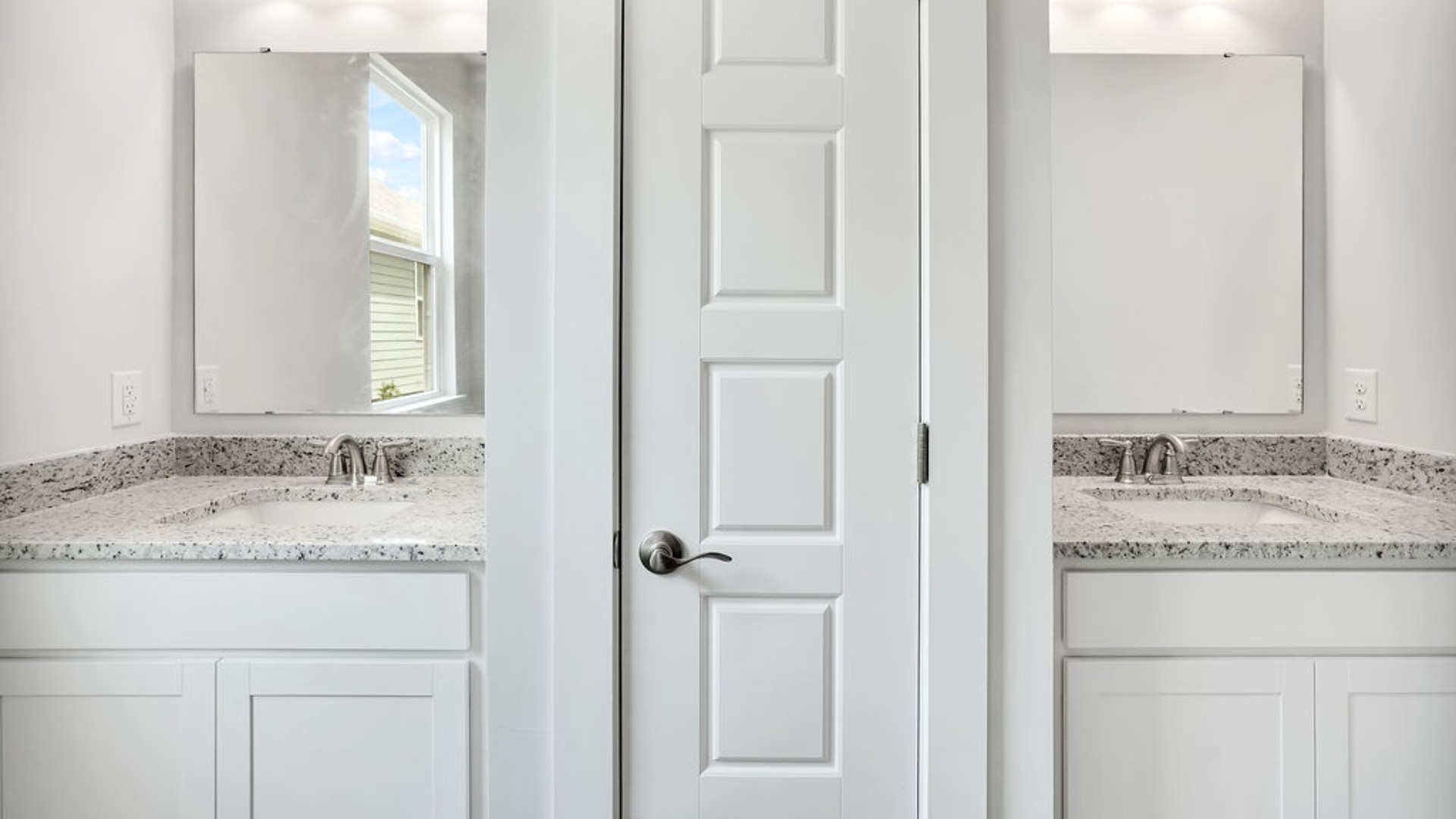The primary suite is tucked away in the back corner of the home and allows homeowners the privacy to relax and unwind. The primary bedroom boasts a walk-in closet, dual vanity, and separate soaking tub and walk-in shower.