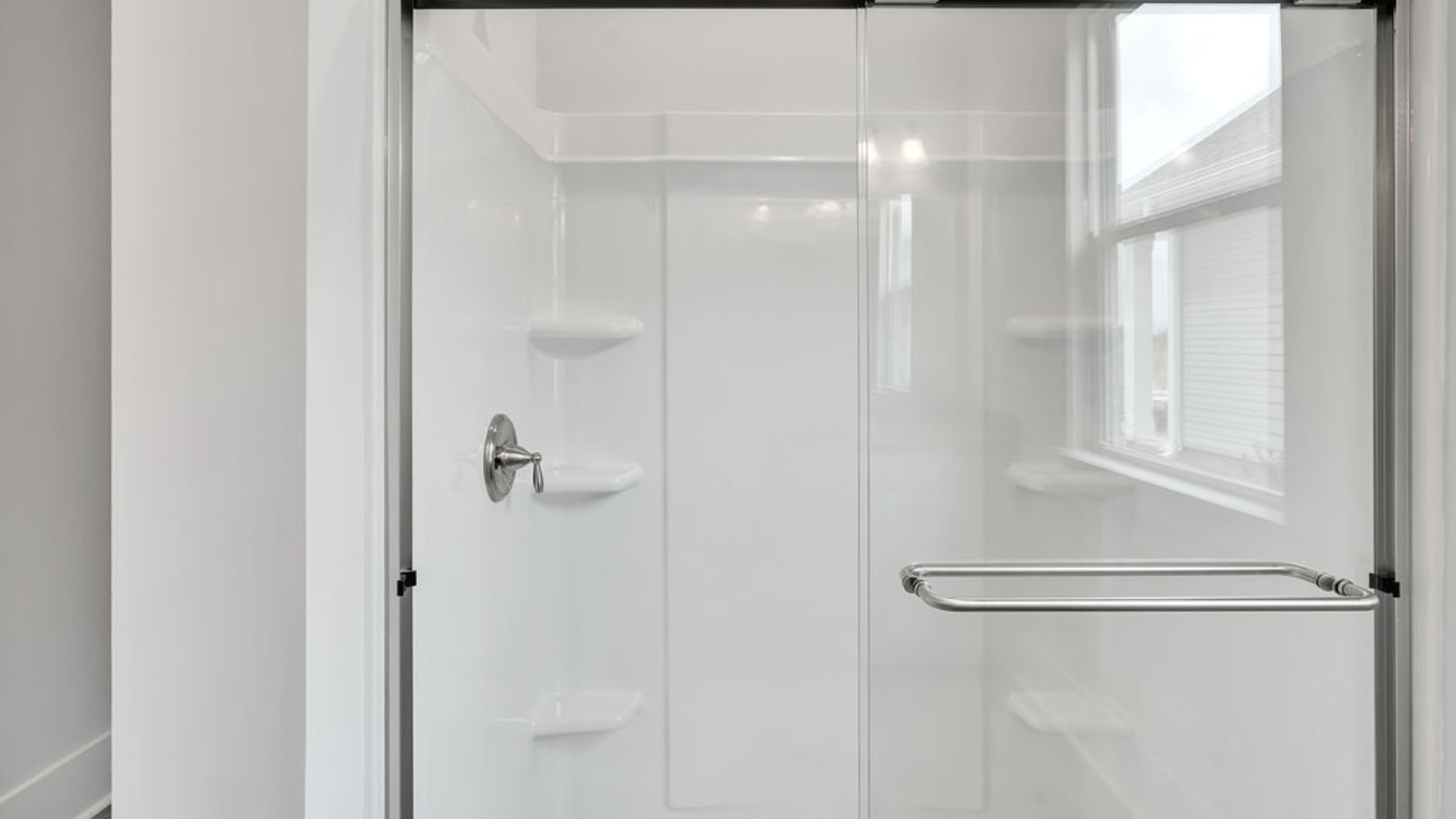The primary suite is tucked away in the back corner of the home and allows homeowners the privacy to relax and unwind. The primary bedroom boasts a walk-in closet, dual vanity, and separate soaking tub and walk-in shower.