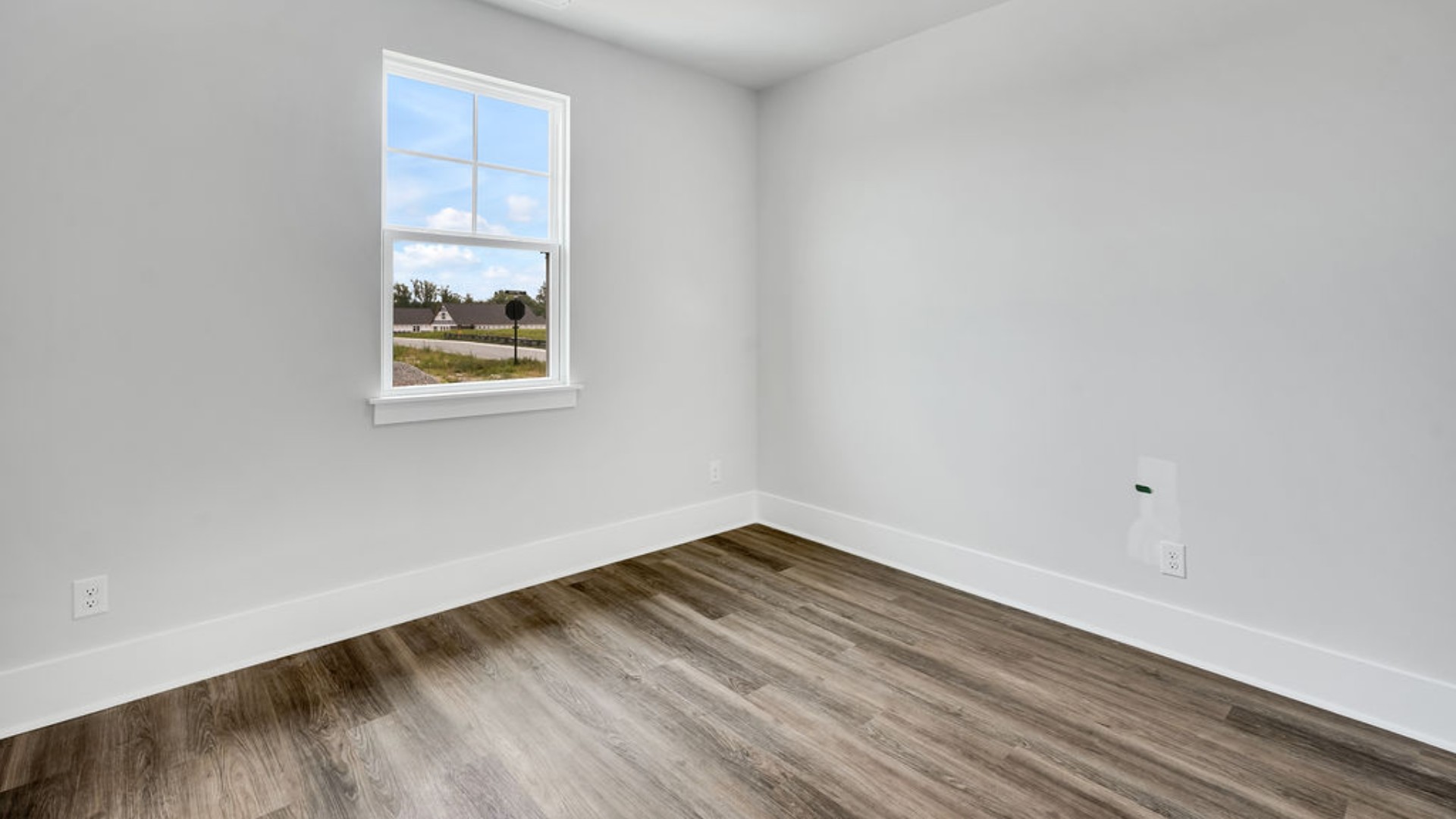As you make your way off the front porch, a foyer leads you into the heart of the home. Two bedrooms sit off the main foyer and share a full bathroom in the middle.