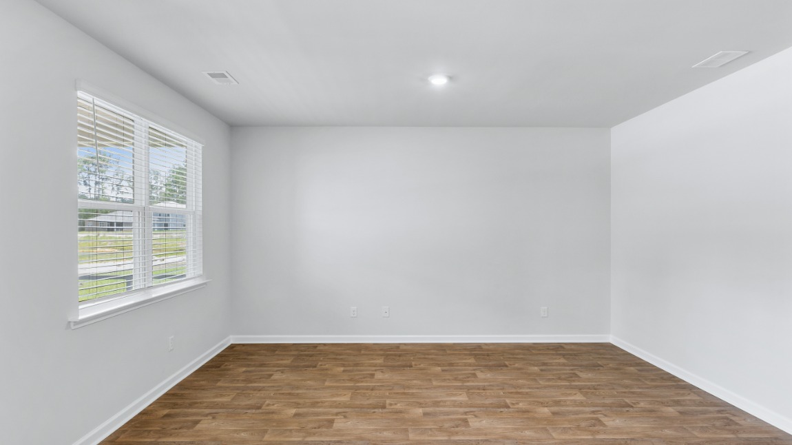 The primary suite is tucked away in the back corner of the home and allows homeowners the privacy to relax and unwind. The primary bedroom boasts a walk-in closet, dual vanity, and separate soaking tub and walk-in shower.