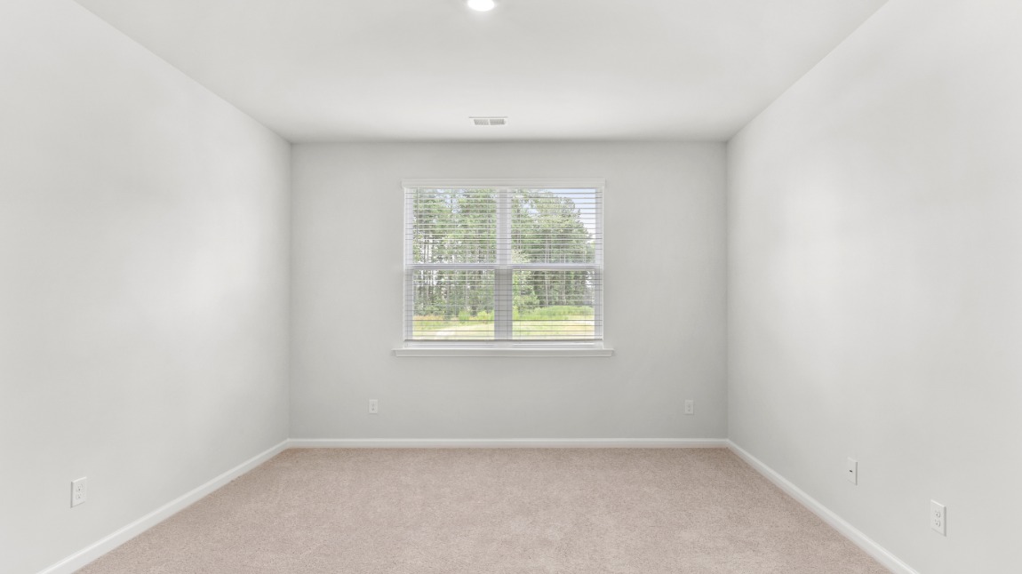 As you make your way off the front porch, a foyer leads you into the heart of the home. Two bedrooms sit off the main foyer and share a full bathroom in the middle.