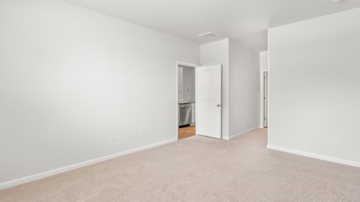 The primary suite includes a walk-in-closet and ensuite bath with a double vanity, walk-in-shower, and separate water closet.