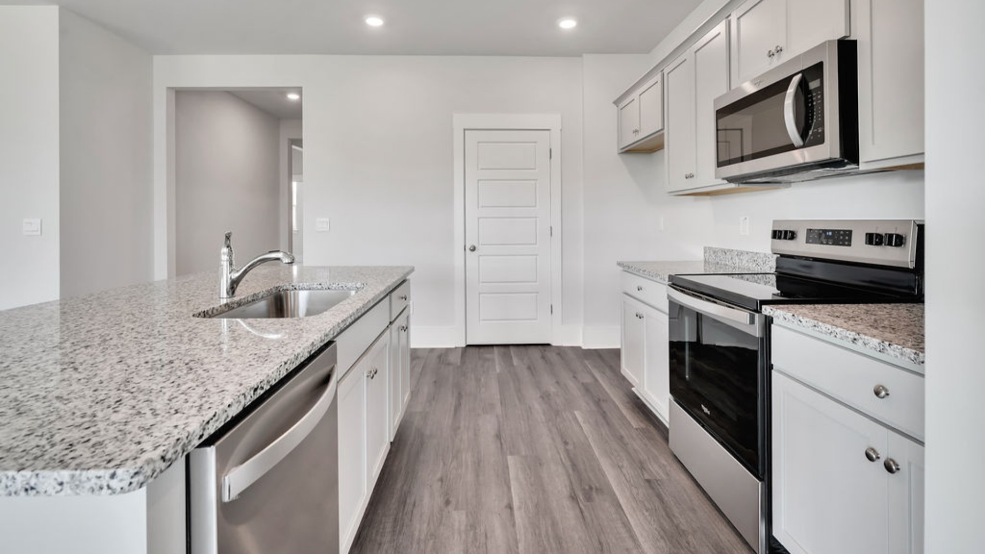 The main living area does not disappoint, by offering plenty of room to gather with family and friends in front of the corner fireplace. The updated kitchen includes a walk-in pantry, stainless-steel appliances, and a large island for bar seating.