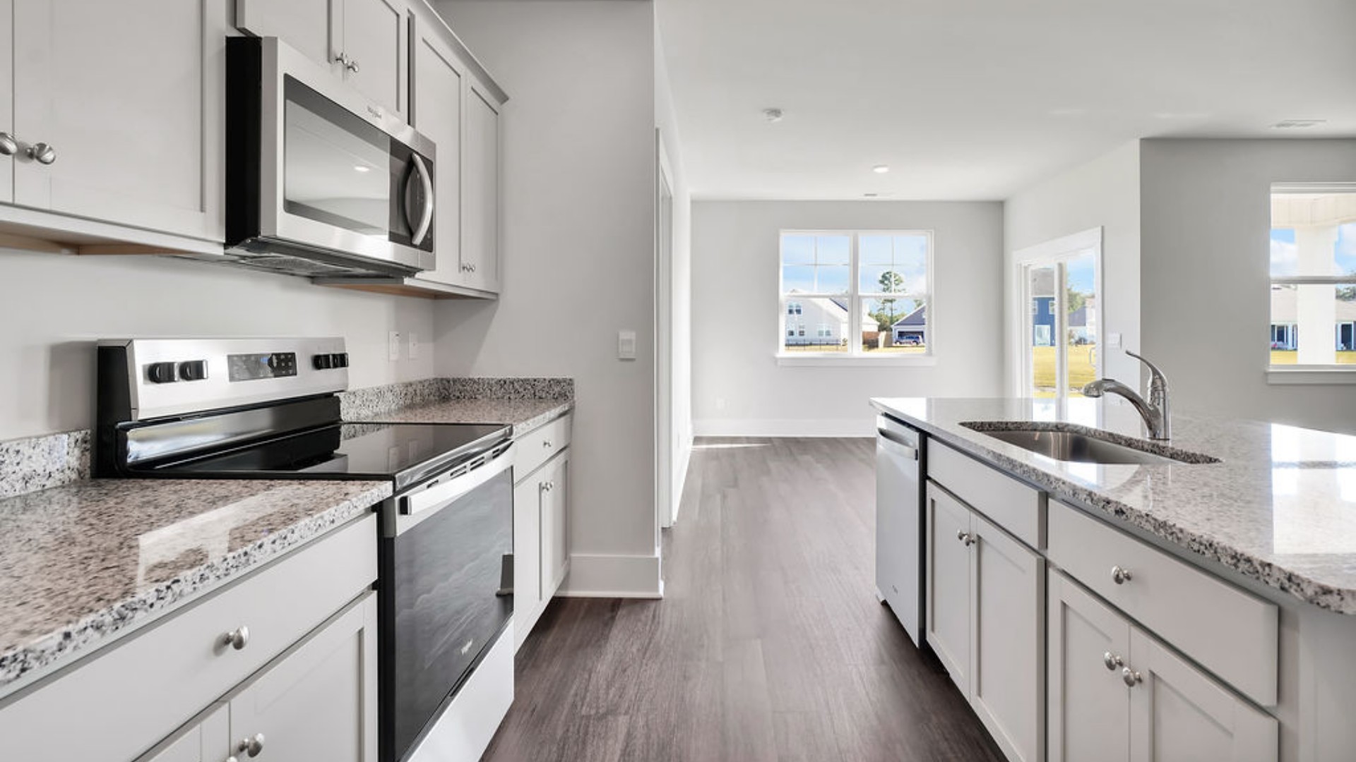 The main living area does not disappoint, by offering plenty of room to gather with family and friends in front of the corner fireplace. The updated kitchen includes a walk-in pantry, stainless-steel appliances, and a large island for bar seating.