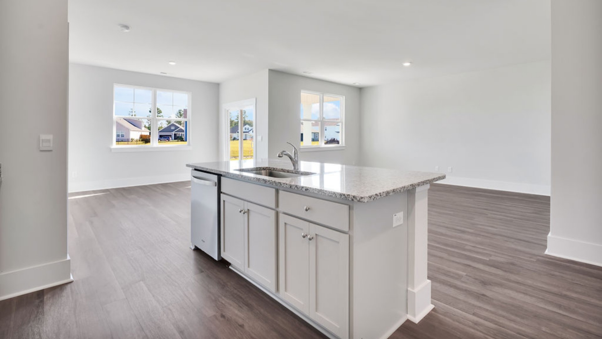 The main living area does not disappoint, by offering plenty of room to gather with family and friends in front of the corner fireplace. The updated kitchen includes a walk-in pantry, stainless-steel appliances, and a large island for bar seating.