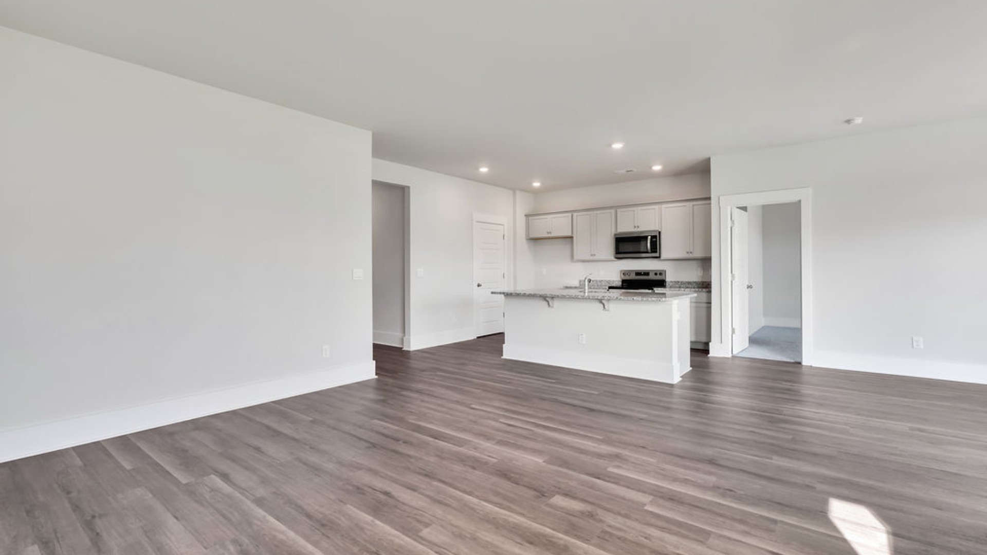 The main living area does not disappoint, by offering plenty of room to gather with family and friends in front of the corner fireplace. The updated kitchen includes a walk-in pantry, stainless-steel appliances, and a large island for bar seating.