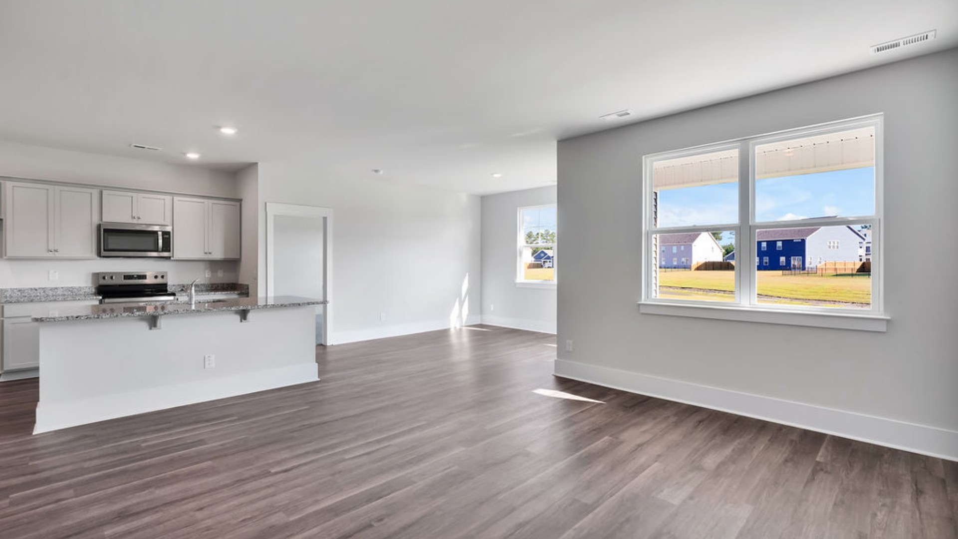 The main living area does not disappoint, by offering plenty of room to gather with family and friends in front of the corner fireplace. The updated kitchen includes a walk-in pantry, stainless-steel appliances, and a large island for bar seating.