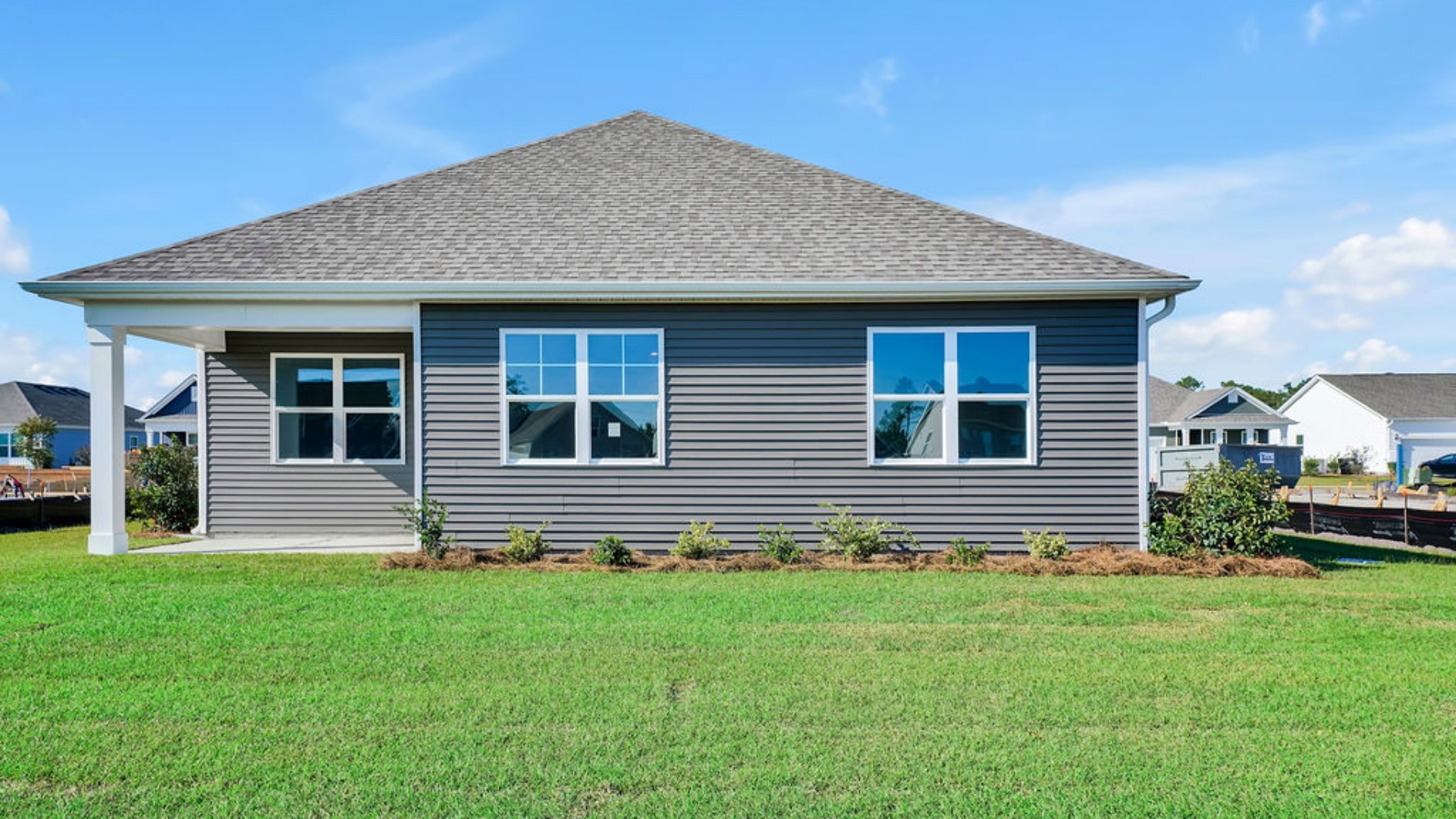 Enjoy a meal with family and friends in the dining area that allows access to the covered back porch.