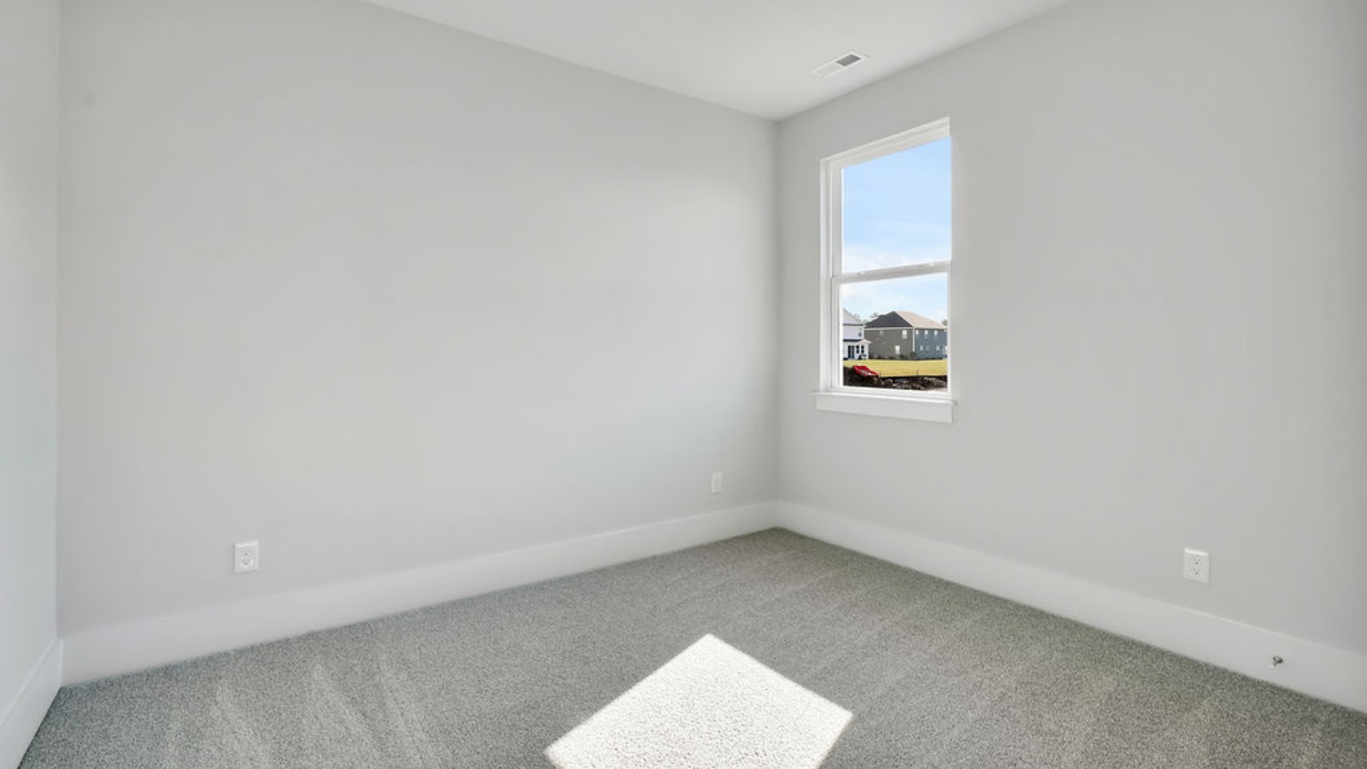 As you make your way off the front porch, a foyer leads you into the heart of the home. Two bedrooms sit off the main foyer and share a full bathroom in the middle.